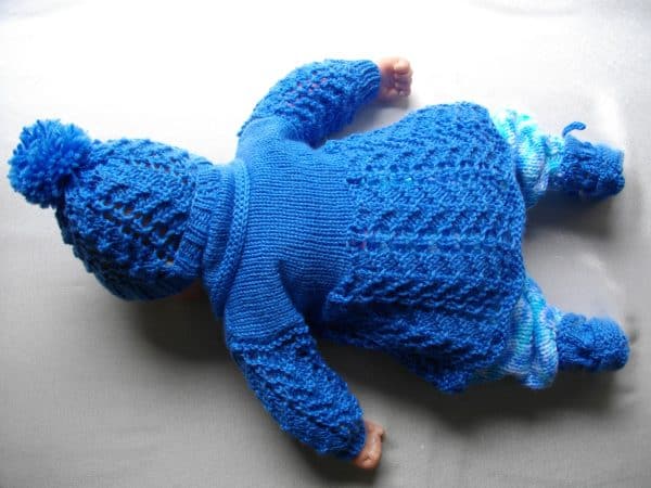 Back of boys hand knitted matinee set