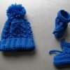 hand knitted bobble hat and bootees
