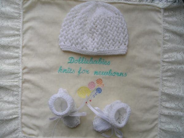 hand knitted baby beanie hat and bootee set