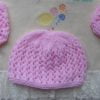 pink hand knitted beanie hat and bootee set