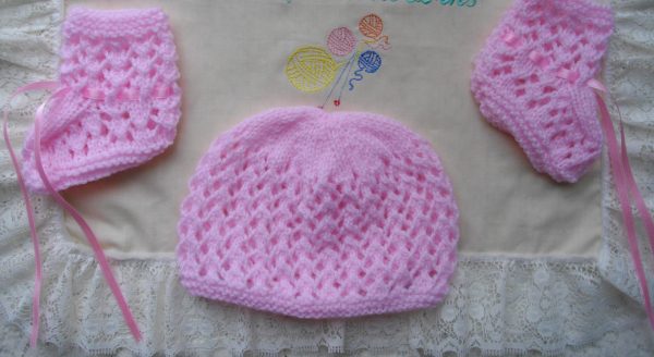pink hand knitted beanie hat and bootee set