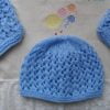 pale blue hand knitted beanie hat and bootee set