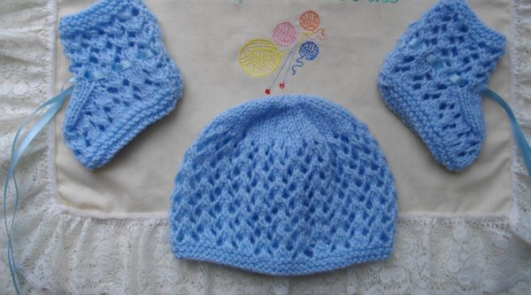 pale blue hand knitted beanie hat and bootee set